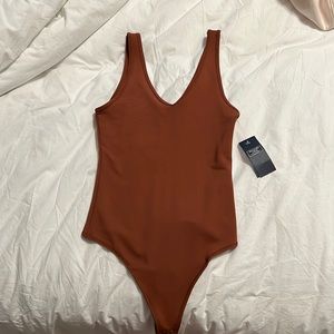 Abercrombie and Fitch “soft collection” Burnt Orange Deep V BodySuit NEVER WORN